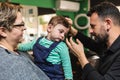 Toddler's first haircut at barber shop