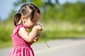 Toddler smelling flower