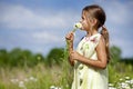 Toddler smelling flower