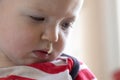 Toddler with snot hanging out of nose