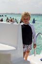 Toddler standing on a boat