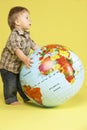 Toddler In Studio With Globe Royalty Free Stock Photo