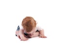 Toddler trying to chew on his toes Royalty Free Stock Photo