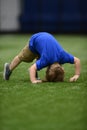 Toddler trying to do tumbling or a somersault at gymnastics Royalty Free Stock Photo