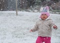 Toddler Walking While Its Snowing Out