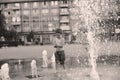 Toddler walking in a splashing water fountain Royalty Free Stock Photo