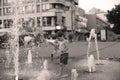 Toddler walking in a splashing water fountain Royalty Free Stock Photo