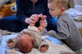 Toddler watches her newborn baby sister Royalty Free Stock Photo