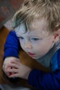 A Toddler watching a television screen in the home