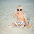 Toddler wearing oversized sunglasses
