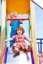 Toddlers on a chute Royalty Free Stock Photo