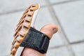 Toe of boy foot in black sandal with grooved sole closeup