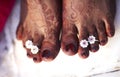 Toe ring and henna marking on woman feet