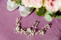 Toecap of women`s shoes with rhinestones and bridesmaid decorations on the bedspread