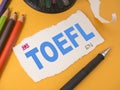 TOEFL, text words typography written on paper, english languange educational