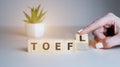Toefl word concept on cubes, english concept