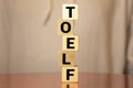 TOEFL - words from wooden blocks with letters, The Test of English as a Foreign Language