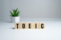 Toeic word on wooden cubes. Toeic concept Royalty Free Stock Photo