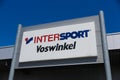 TOENISVORST, GERMANY - JUIN 28. 2019: Close up of logo against blue sky of Intersport Vosswinkel German chain for sports supplies