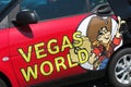 TOENISVORST, GERMANY - JUIN 28. 2019: Close up of logo of Vegas World german gambling hall chain on door of red car
