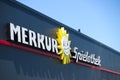 TOENISVORST, GERMANY - JUIN 28. 2019: Close up of text and sun logo on black facade with blue sky of Merkur Spielothek german