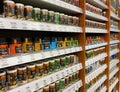 View on shelf in german supermarket with cans of spices and seasonings in a row