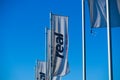TOENISVORST, GERMANY - MARCH 22. 2019: Flags with logo of Real German supermarket chain against clear blue sky