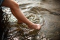 Toes dipping in water