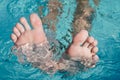 Toes peeking out of the water. Foot with the pool background. Toes close up Royalty Free Stock Photo