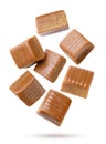 Toffee candies flying on a white background. Isolated Royalty Free Stock Photo