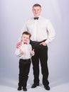 Toffs father and son in formal suit. small boy with dad businessman. family day. male fashion. parenting. fathers day