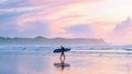 Tofino Vancouver Island Pacific rim coast, surfers with board during sunset at the beach Royalty Free Stock Photo