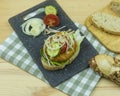 tofu patties on ciabatta bread with tomatoes, onion cucumber and lettuce Royalty Free Stock Photo