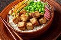 Tofu poke bowl with basmati rice and veggies Royalty Free Stock Photo