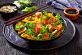 Tofu salad with greens and vegetables in bowl Royalty Free Stock Photo