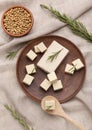 Tofu and soybeans on wooden plates with rosemary Royalty Free Stock Photo