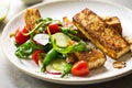 Tofu steak with Snow Peas and Rocket Salad