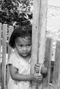 TOGEAN ISLANDS - September 05, 2014 portrait of unidentified girl hugging a pole with a colored pastel in the hand, it is