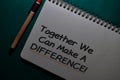 Together We Can Make A Difference! write on a Book isolated on Office Desk Royalty Free Stock Photo