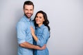 Together forever. Portrait of handsome charming married people spouses isolated feeling cheerful joyful wearing denim