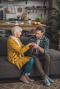 Grey-haired elderly lady feeling greatl with her son Royalty Free Stock Photo