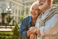 Always together. Happy senior couple bonding to each other and smiling while spending time together outdoors Royalty Free Stock Photo