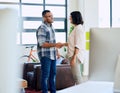 Together, they make an unstoppable partnership. a young man and woman shaking hands in a modern office. Royalty Free Stock Photo