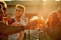 Together is our favorite place to be. a group of young diverse friends having a drink and spending the day outside on a Royalty Free Stock Photo