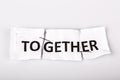 TOGETHER words written on torn and stapled paper Royalty Free Stock Photo