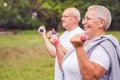 Together we workout better - Smiling senior couple practice with dumbbells