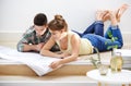 In this together. a young couple inspecting the building plans for their new home. Royalty Free Stock Photo