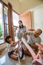 Togetherness of father, mother and daughter installing a basket