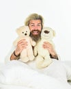 Togetherness. Sick man with flu lying in the bed. sleeping at home in bed with his toy. man sleeping in embrace with Royalty Free Stock Photo