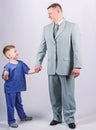 Togetherness. trust and values. fathers day. family day. father and son in business suit. male fashion. happy child with